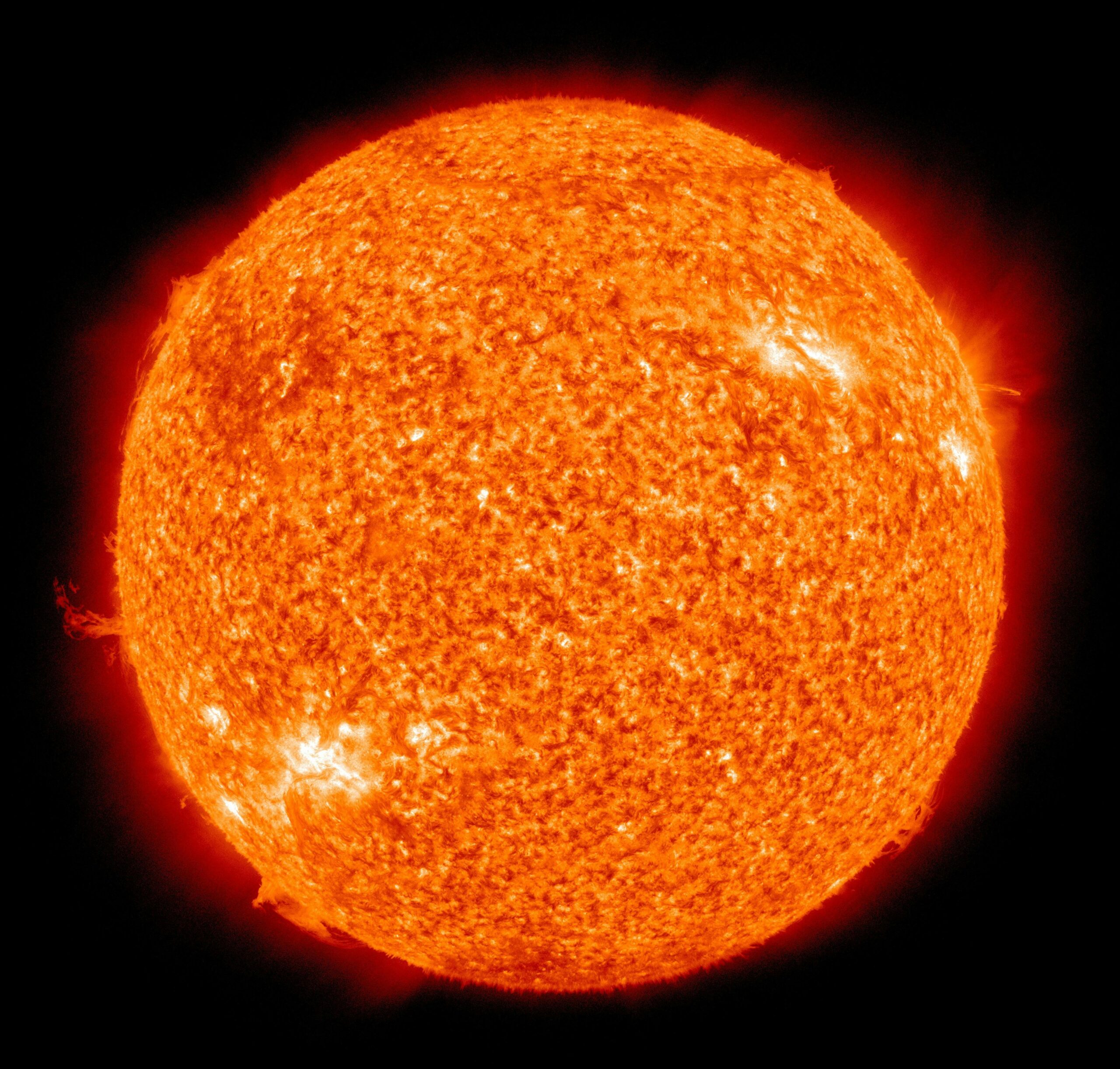 Detailed image of the sun showcasing its fiery surface and glowing edges.